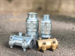 Gama de accesorios FixSTH de Standard Hidráulica: tapaporos y enlaces de compresión mecánica en fundición y latón para reparación de tuberías sin soldadura